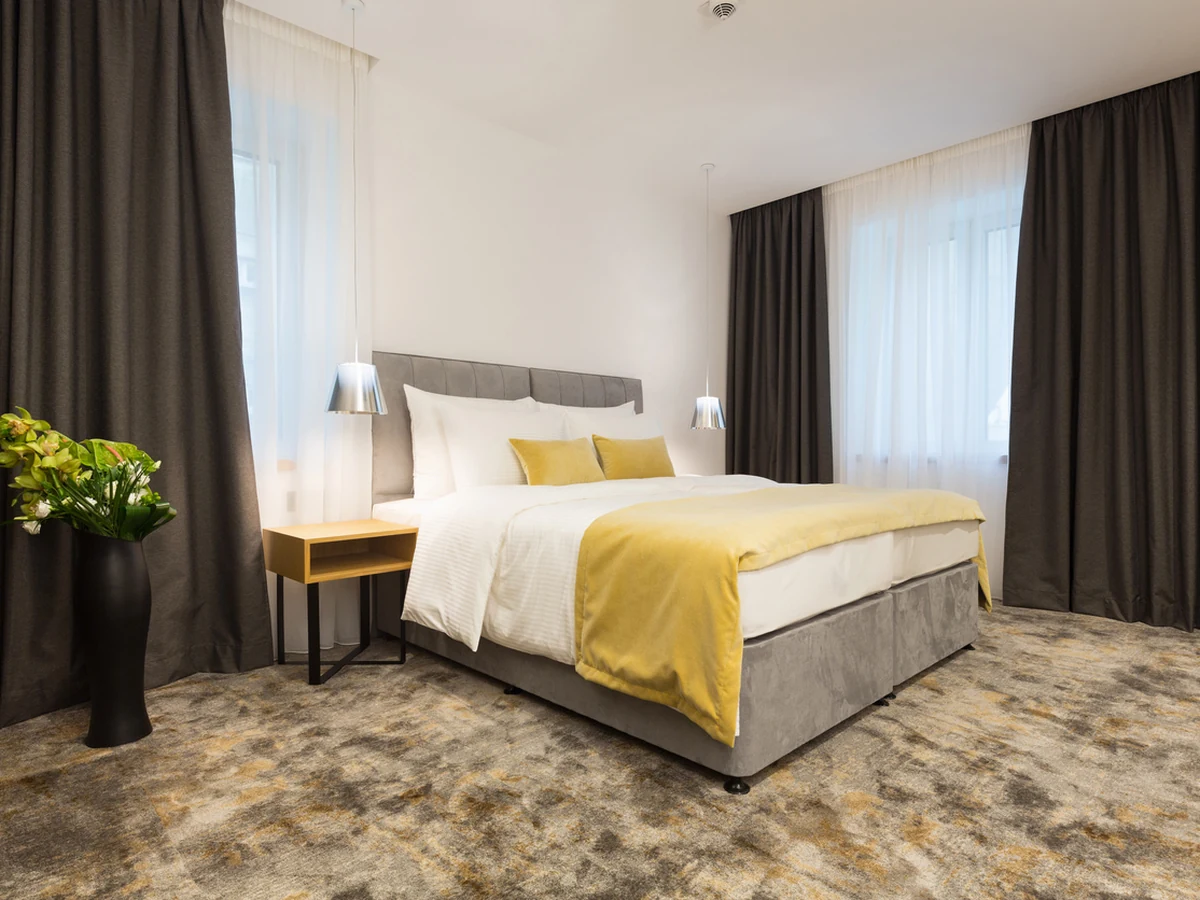 Hotel-style bedroom with fresh painted walls by Reading Decorators