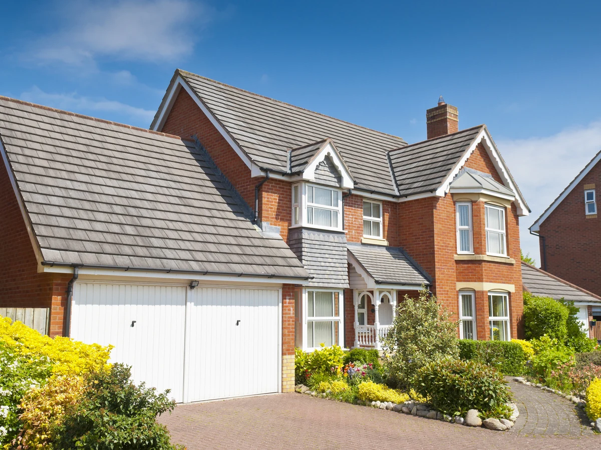 Red brick detached house exterior painting in Reading by Reading Decorators