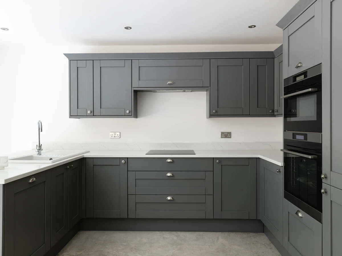 Sleek dark grey kitchen cabinet painting project by Reading Decorators