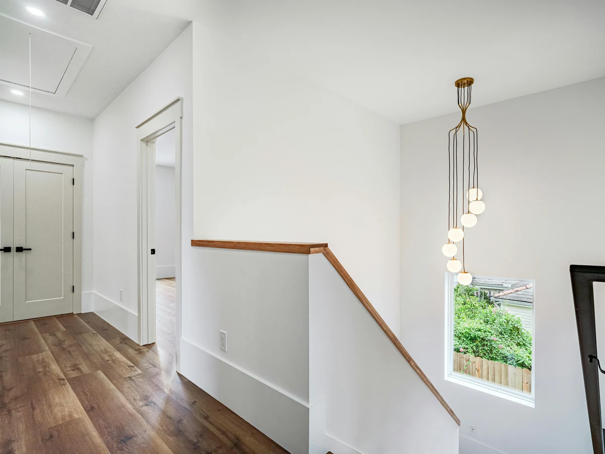 Modern staircase landing painted white by Reading Decorators