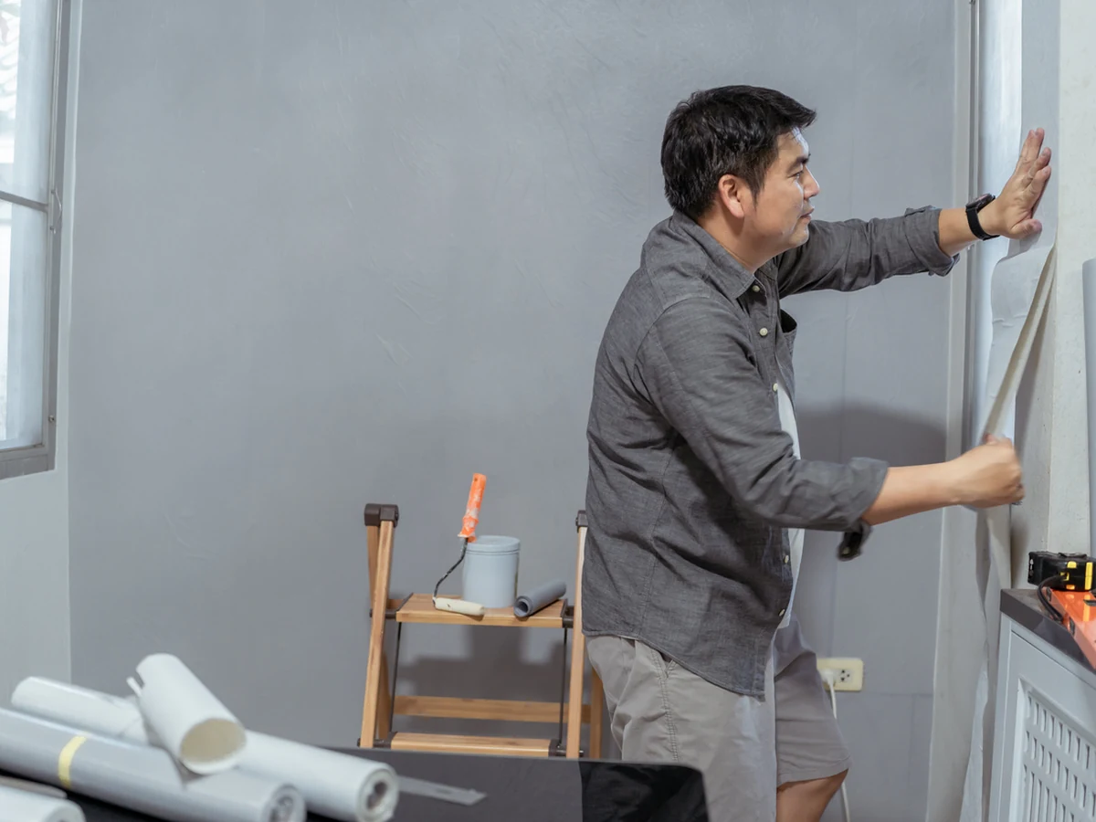 Wallpaper installer hanging wallpaper in Reading by Reading Decorators, professional decorators